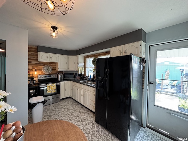 205 N Bentley St, Marion, IL 62959 - kitchen with white cabinetry, a sink, stainless steel appliances, and dark countertops