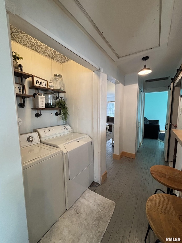 205 N Bentley St, Marion, IL 62959 - laundry area featuring wood-type flooring, baseboards, separate washer and dryer, a barn door, and visible vents