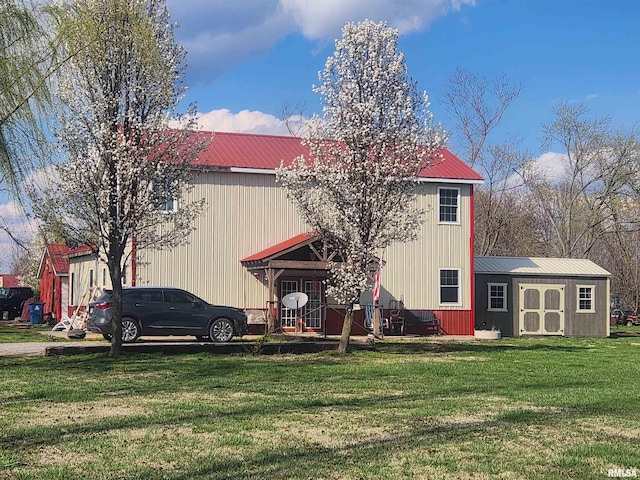 17116 Old Town Dr, Sesser, IL 62884 - view of front of home featuring a front lawn, an outdoor structure, and metal roof