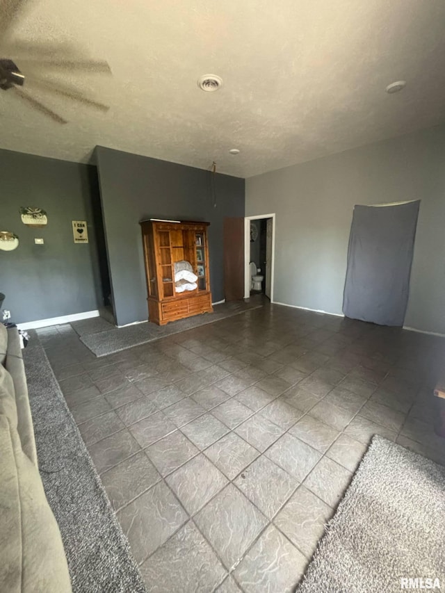 17116 Old Town Dr, Sesser, IL 62884 - unfurnished living room with baseboards and a ceiling fan