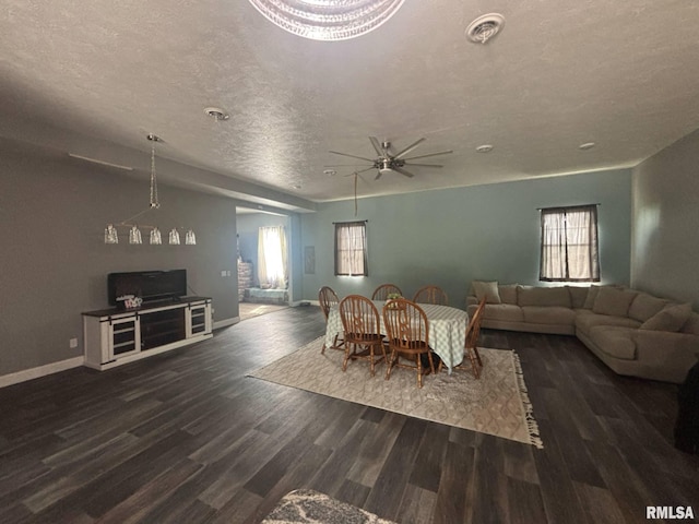 17116 Old Town Dr, Sesser, IL 62884 - dining room with wood finished floors, a textured ceiling, and a healthy amount of sunlight