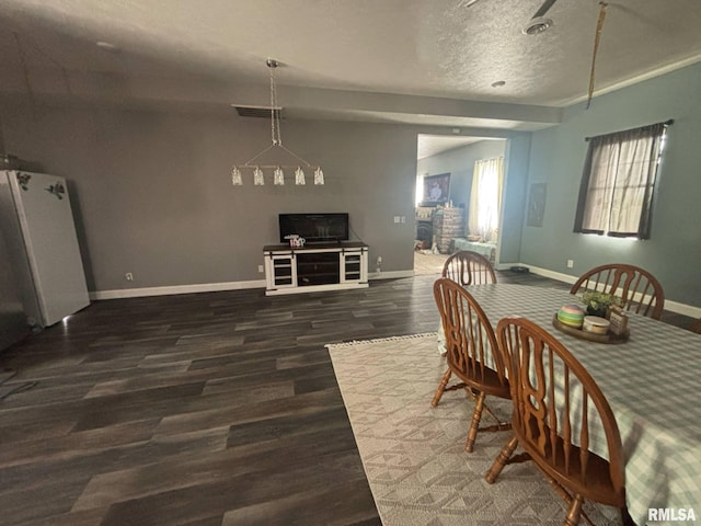 17116 Old Town Dr, Sesser, IL 62884 - dining area with wood finished floors, a textured ceiling, and baseboards