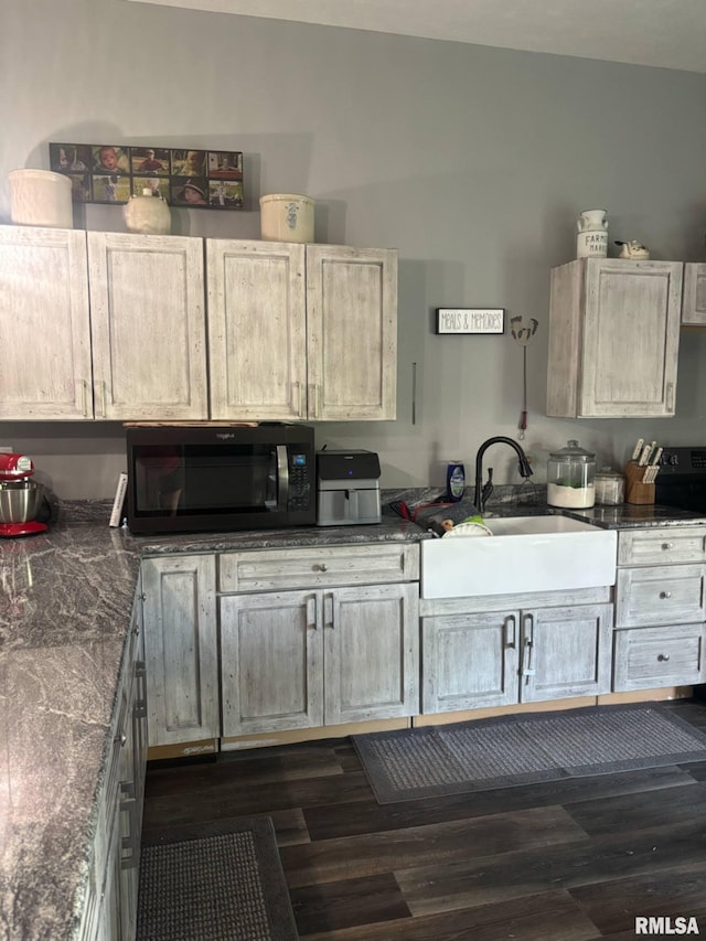 17116 Old Town Dr, Sesser, IL 62884 - kitchen featuring black microwave, dark countertops, and dark wood-style floors