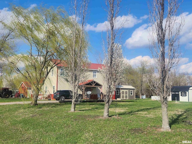 17116 Old Town Dr, Sesser, IL 62884 - view of front facade with a front lawn, an outbuilding, a deck, and a shed