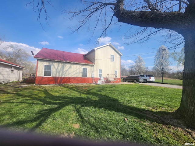 17116 Old Town Dr, Sesser, IL 62884 - view of property exterior with a yard and metal roof