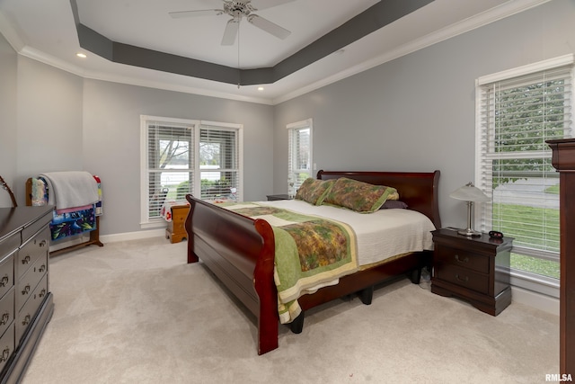 bedroom featuring crown molding, a tray ceiling, recessed lighting, light carpet, and baseboards