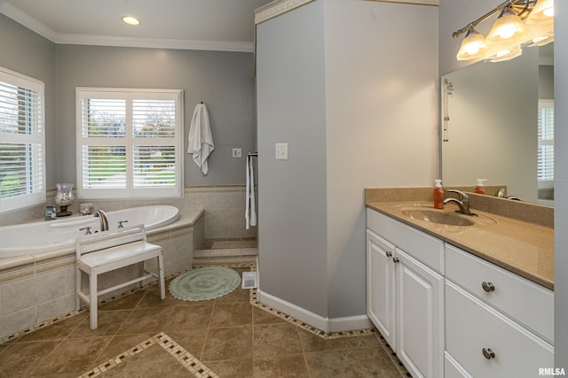 bathroom featuring ornamental molding, recessed lighting, vanity, tile patterned floors, and a garden tub