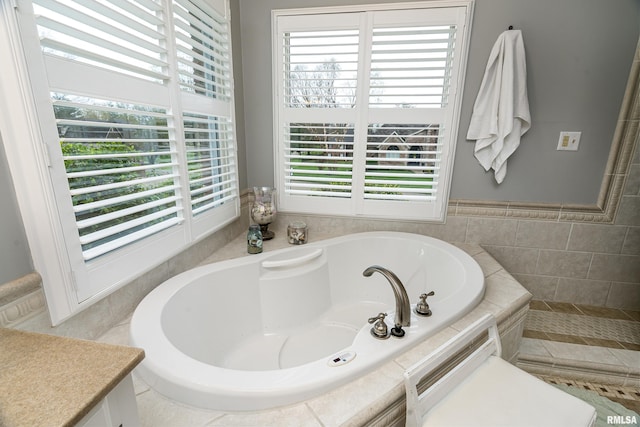 bathroom with a garden tub