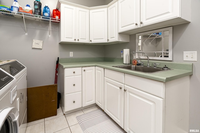 washroom with washing machine and clothes dryer, a sink, cabinet space, and light tile patterned floors