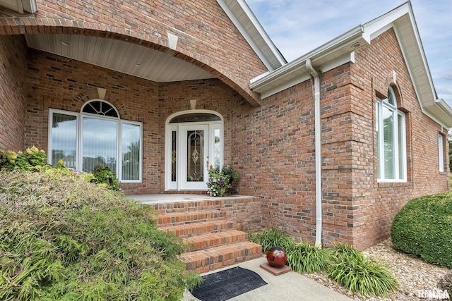 entrance to property with brick siding