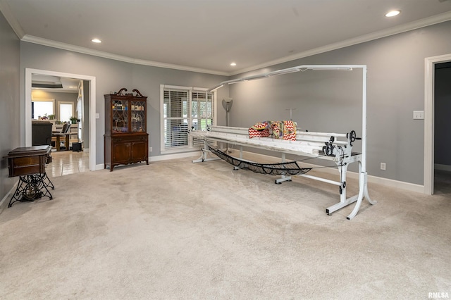 carpeted dining room with crown molding, baseboards, and recessed lighting