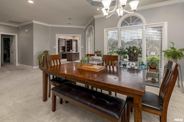 dining room with baseboards, a notable chandelier, ornamental molding, recessed lighting, and light colored carpet