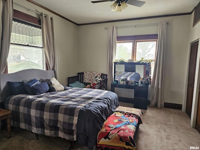 107 W Lincoln St, Harrisburg, IL 62946 - carpeted bedroom with baseboards, a textured ceiling, ornamental molding, and ceiling fan