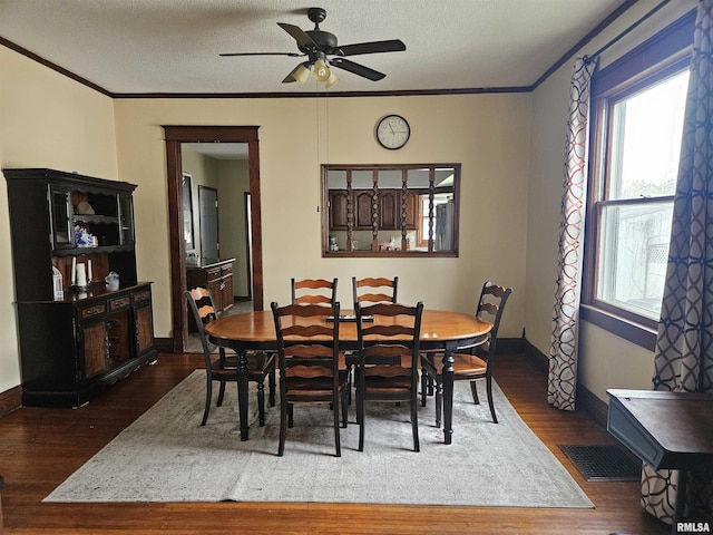 107 W Lincoln St, Harrisburg, IL 62946 - dining area featuring wood finished floors, ceiling fan, and ornamental molding