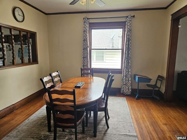 107 W Lincoln St, Harrisburg, IL 62946 - dining room featuring wood finished floors, baseboards, ornamental molding, and visible vents