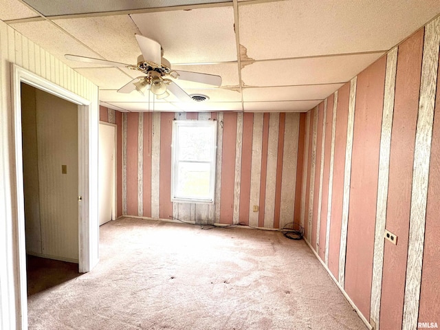 unfurnished room featuring visible vents, a ceiling fan, and carpet floors