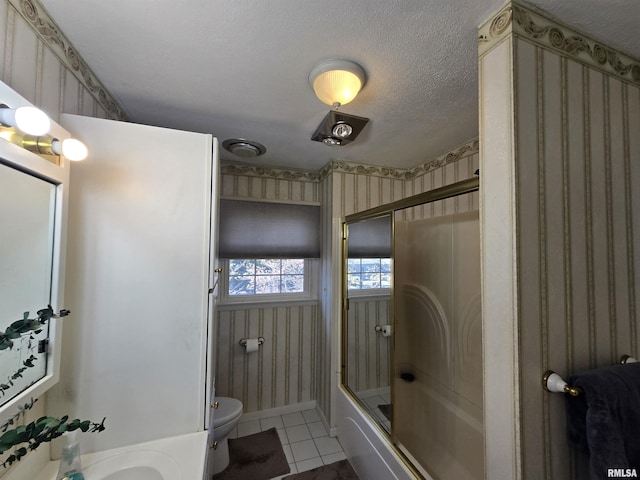 full bath featuring toilet, bath / shower combo with glass door, wallpapered walls, and tile patterned floors