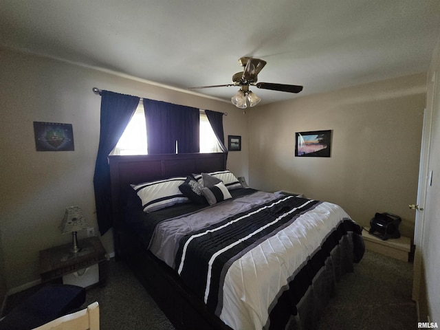 bedroom with a ceiling fan and carpet