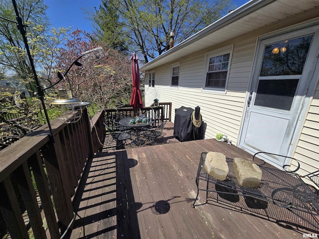 wooden deck with outdoor dining area