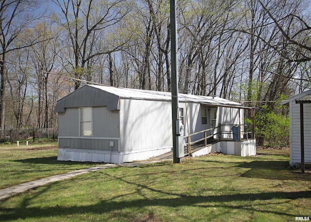 11648 Trolley Line Rd, Marion, IL 62959 - view of side of home with a yard and fence