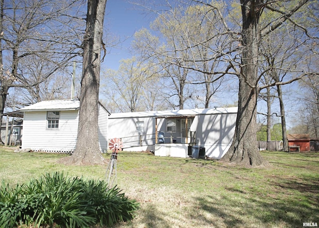 11648 Trolley Line Rd, Marion, IL 62959 - view of front of home with a porch, an outbuilding, and a front lawn