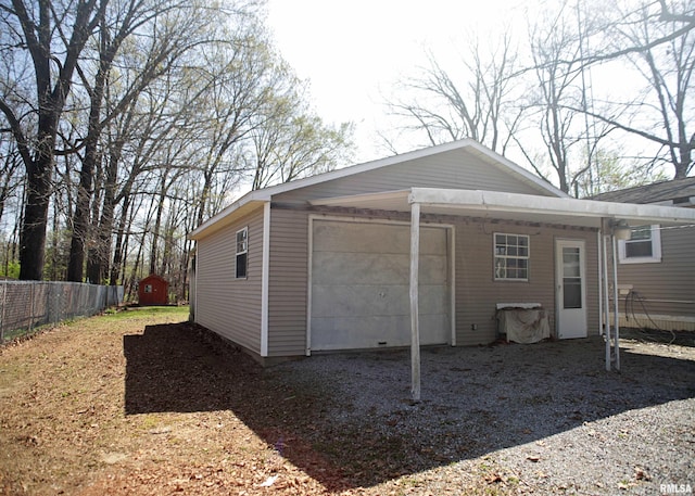 11648 Trolley Line Rd, Marion, IL 62959 - rear view of house with a garage, driveway, and fence