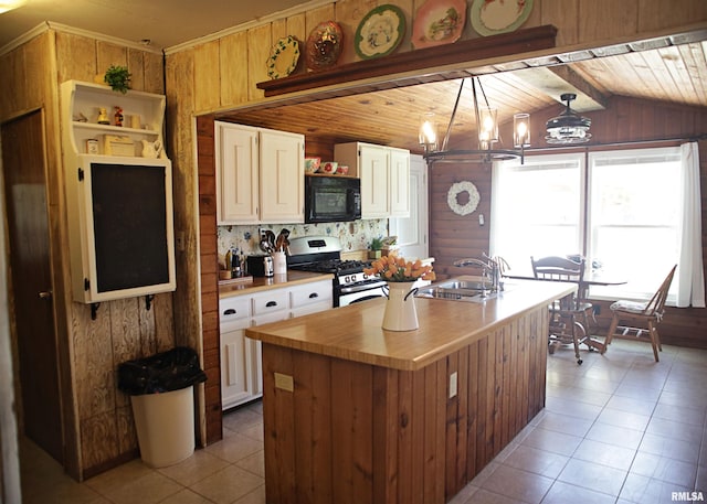 11648 Trolley Line Rd, Marion, IL 62959 - kitchen with black microwave, open shelves, white cabinets, gas range, and a sink