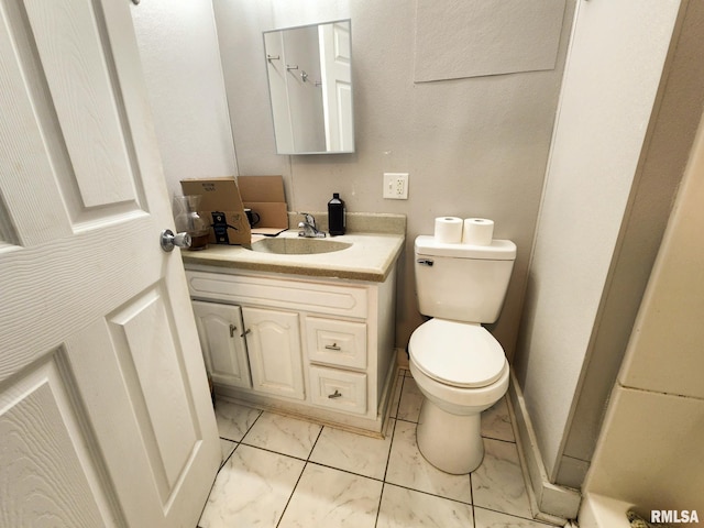 609 S Poplar St, Carbondale, IL 62901 - bathroom with vanity, marble finish floor, and toilet