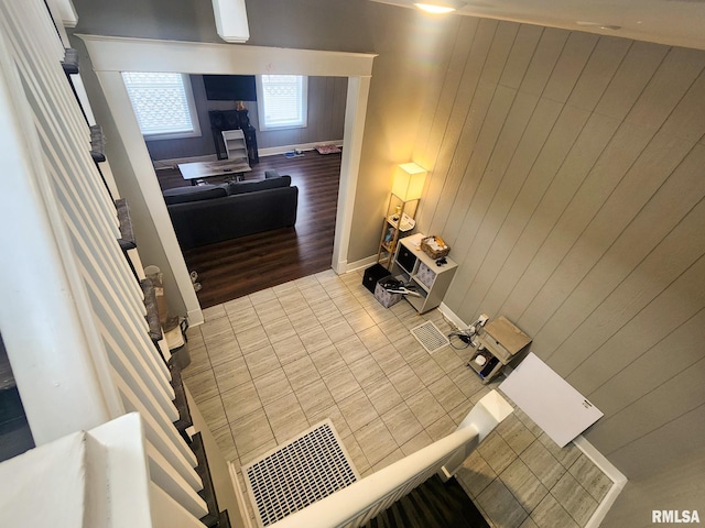 609 S Poplar St, Carbondale, IL 62901 - interior space featuring wooden walls, baseboards, and wood finished floors