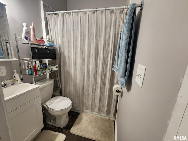 609 S Poplar St, Carbondale, IL 62901 - bathroom with tile patterned floors, toilet, and vanity