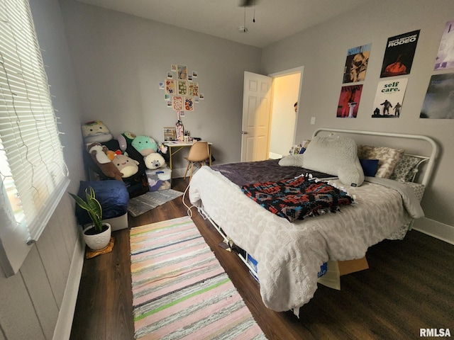 609 S Poplar St, Carbondale, IL 62901 - bedroom with baseboards and wood finished floors