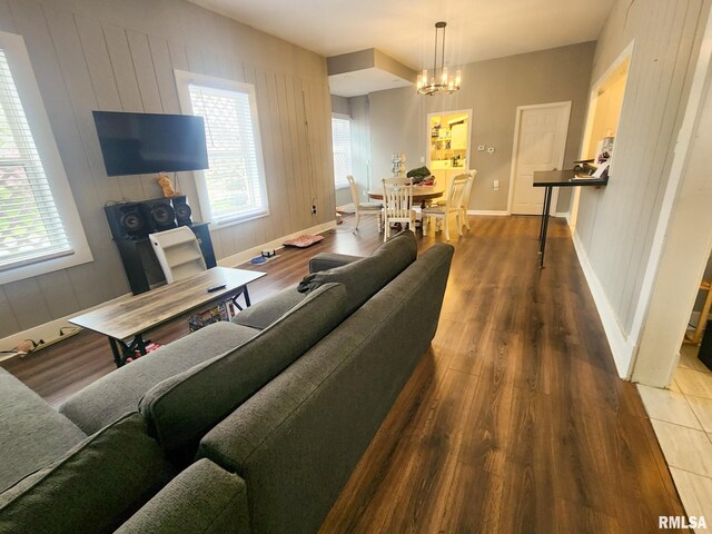 609 S Poplar St, Carbondale, IL 62901 - living area with a chandelier, wood finished floors, and baseboards