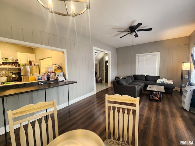 609 S Poplar St, Carbondale, IL 62901 - living area featuring wood finished floors, ceiling fan with notable chandelier, and baseboards