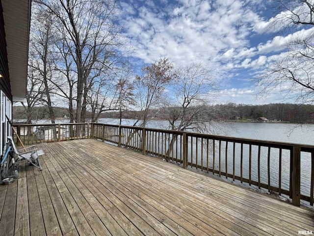 wooden deck featuring a water view