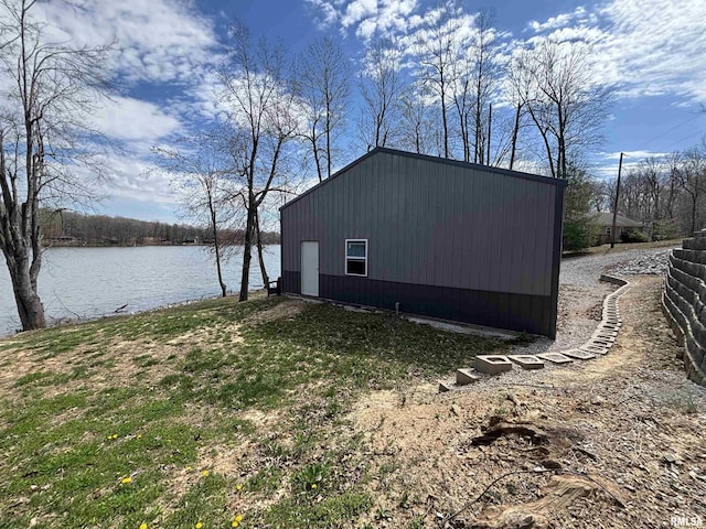 view of outdoor structure with a water view and an outdoor structure