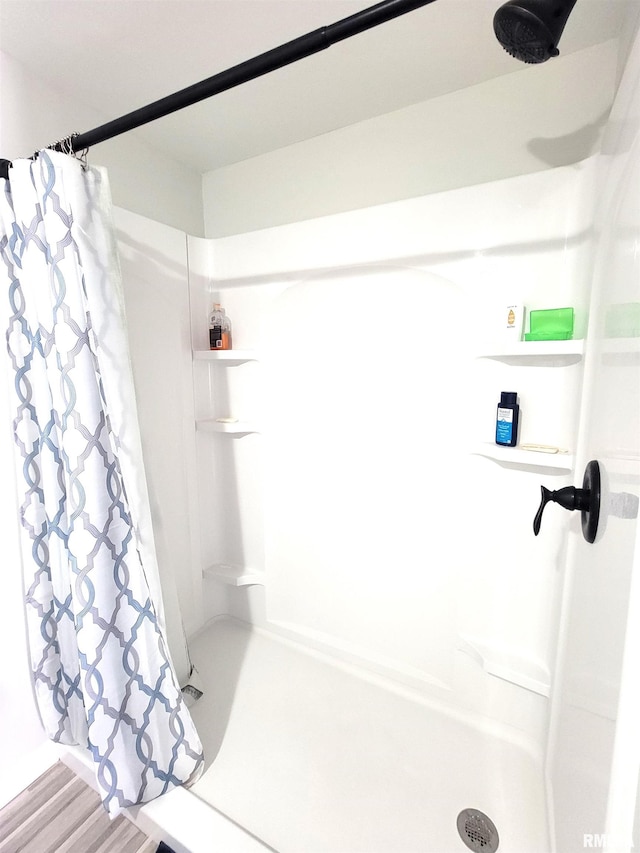 bathroom with a shower stall