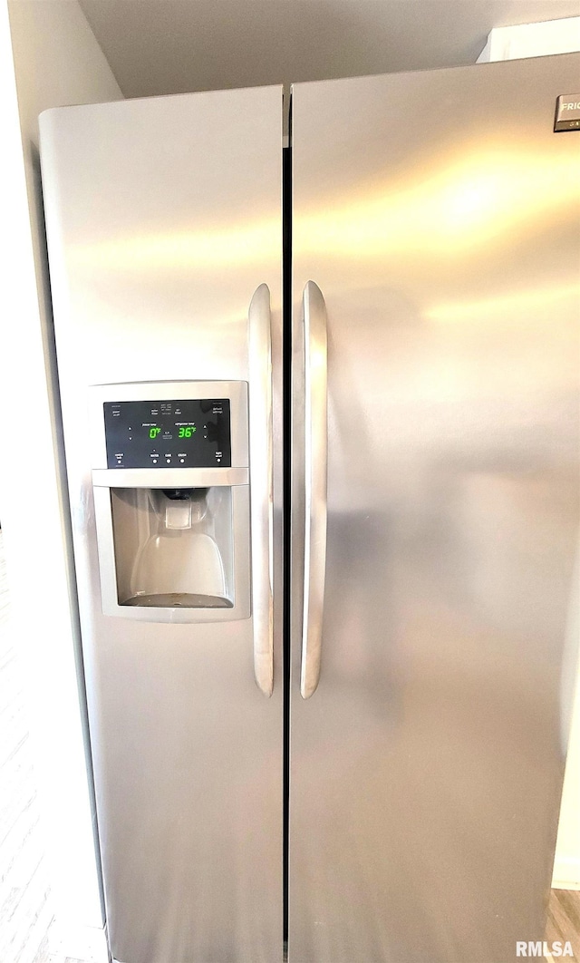interior details with stainless steel refrigerator with ice dispenser