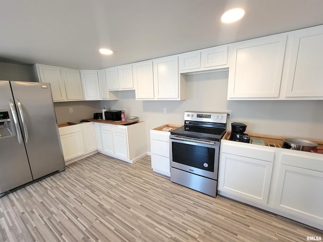 kitchen with white cabinetry, appliances with stainless steel finishes, recessed lighting, and light wood finished floors
