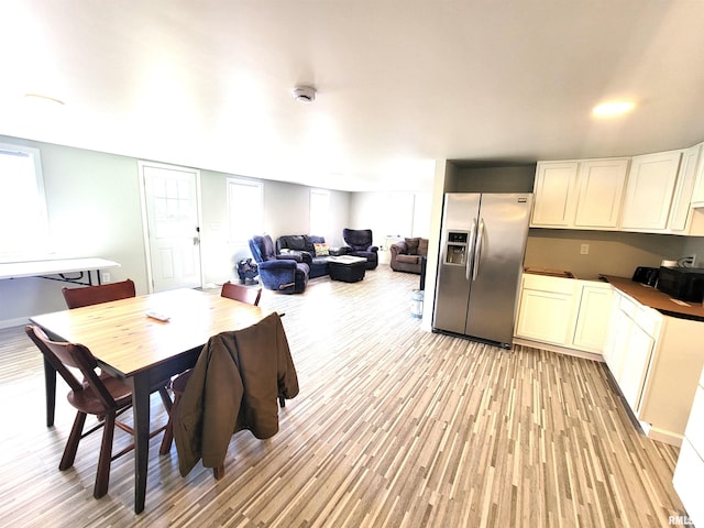 dining space with light wood-style floors