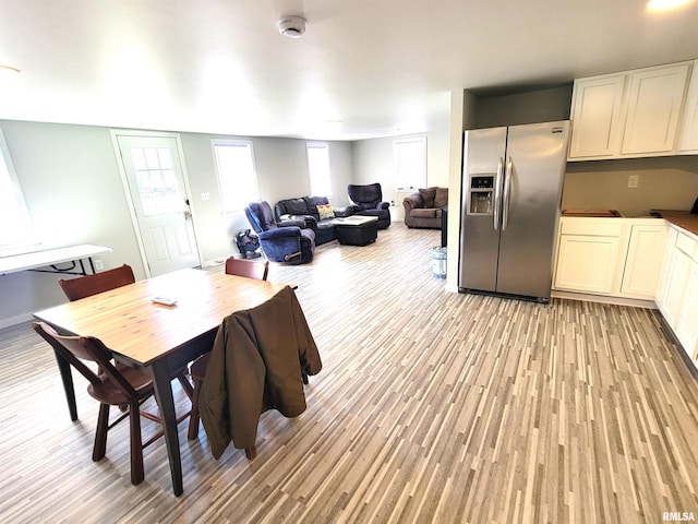 dining space with light wood-type flooring