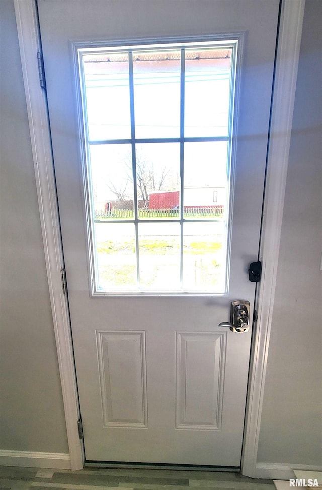 entryway featuring baseboards
