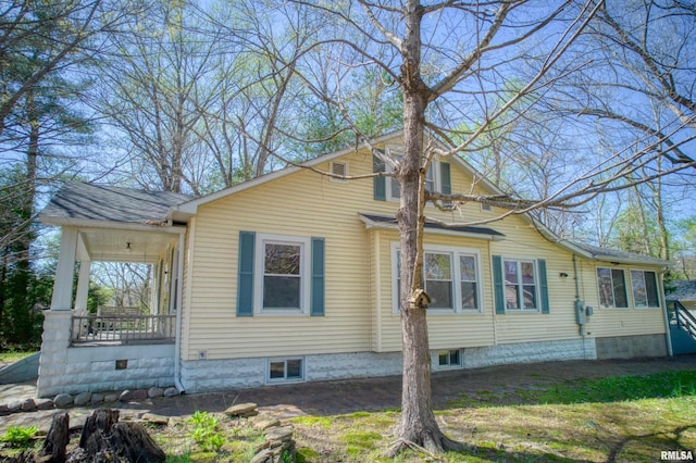 view of property exterior with a porch