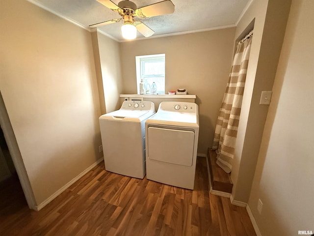 clothes washing area featuring baseboards, crown molding, a ceiling fan, independent washer and dryer, and wood finished floors