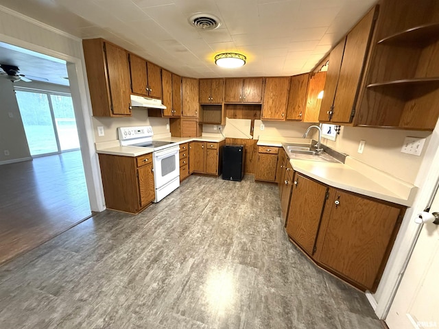 kitchen featuring white electric range, visible vents, under cabinet range hood, a sink, and brown cabinets