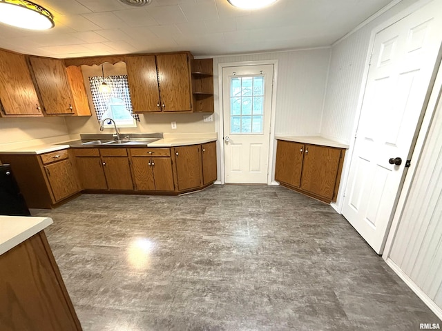 kitchen with dark floors, brown cabinetry, open shelves, and a healthy amount of sunlight