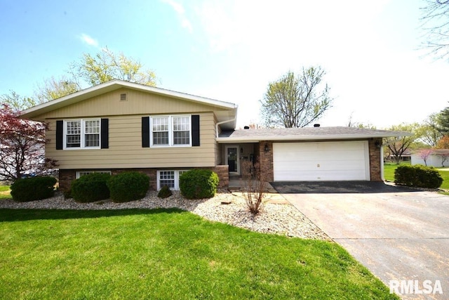 tri-level home with a front lawn, a garage, and concrete driveway