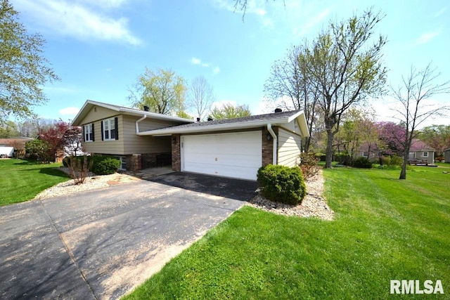 split level home featuring concrete driveway, a front yard, and a garage