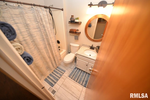 full bathroom with tile patterned floors, toilet, shower / bathtub combination with curtain, and vanity