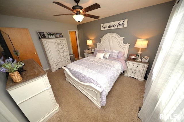carpeted bedroom featuring a ceiling fan