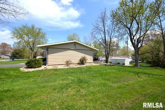 view of property exterior featuring an outbuilding and a lawn